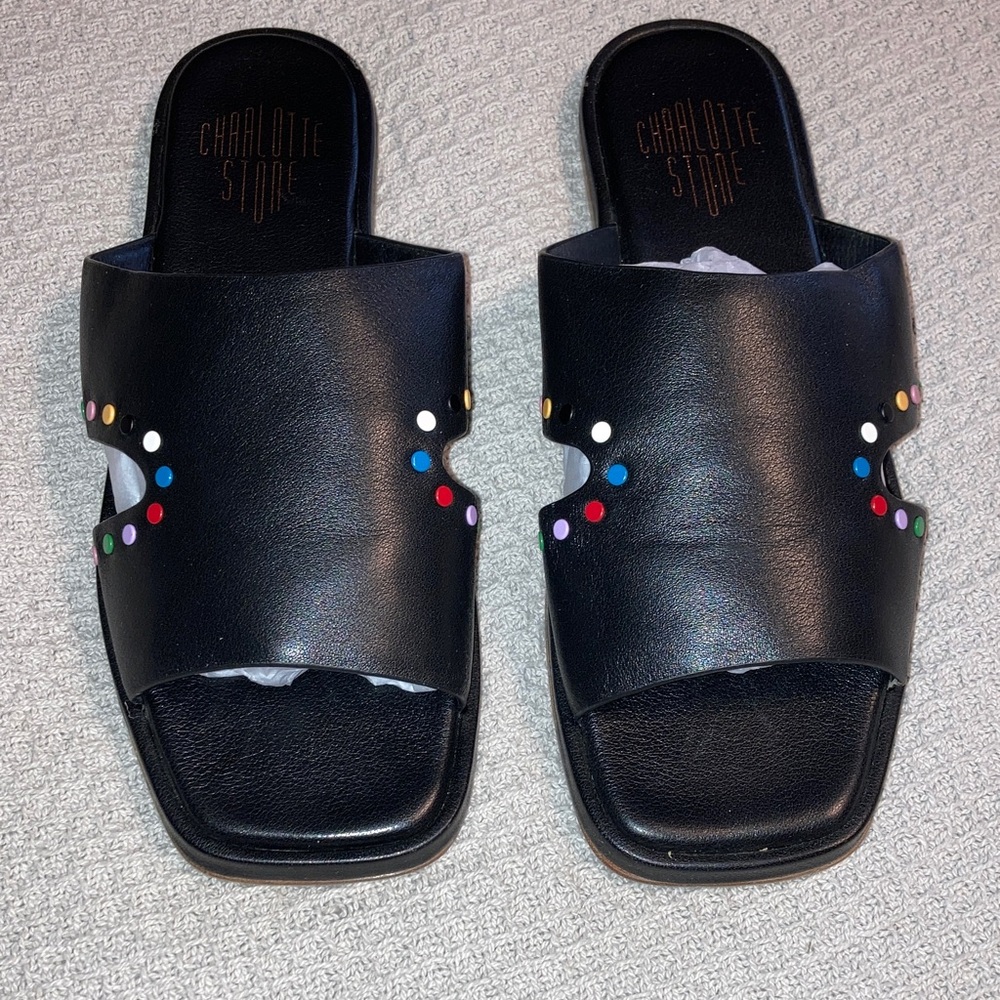 Charlotte Stone “Kori” slide on sandals with multi color studs. Size 9